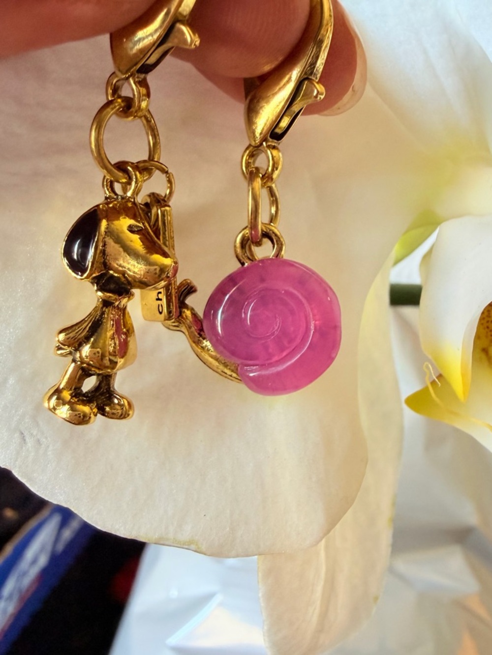 Gold-tone Dog Charm Earrings with Pink Swirl Accent